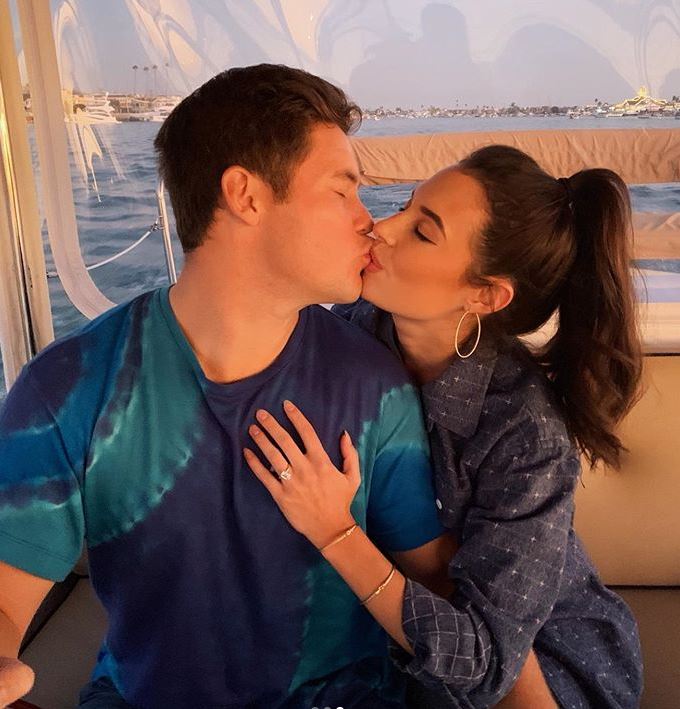 Chloe Bridges with her fiance, Adam Devine. | Source: Instagram.com